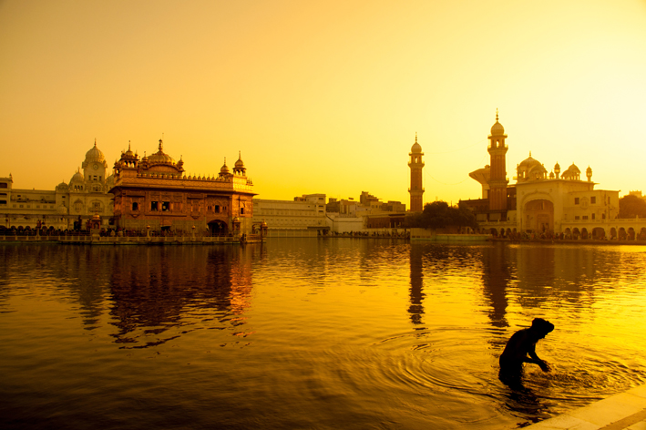 Indian City with river in yellow light_Feng Shui Travel Tips 