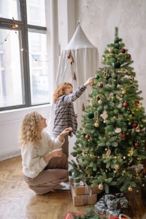 Mom and Child decorating a Christmas Tree