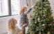 Mom and Child decorating a Christmas Tree